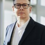 Executive in a suit and glasses