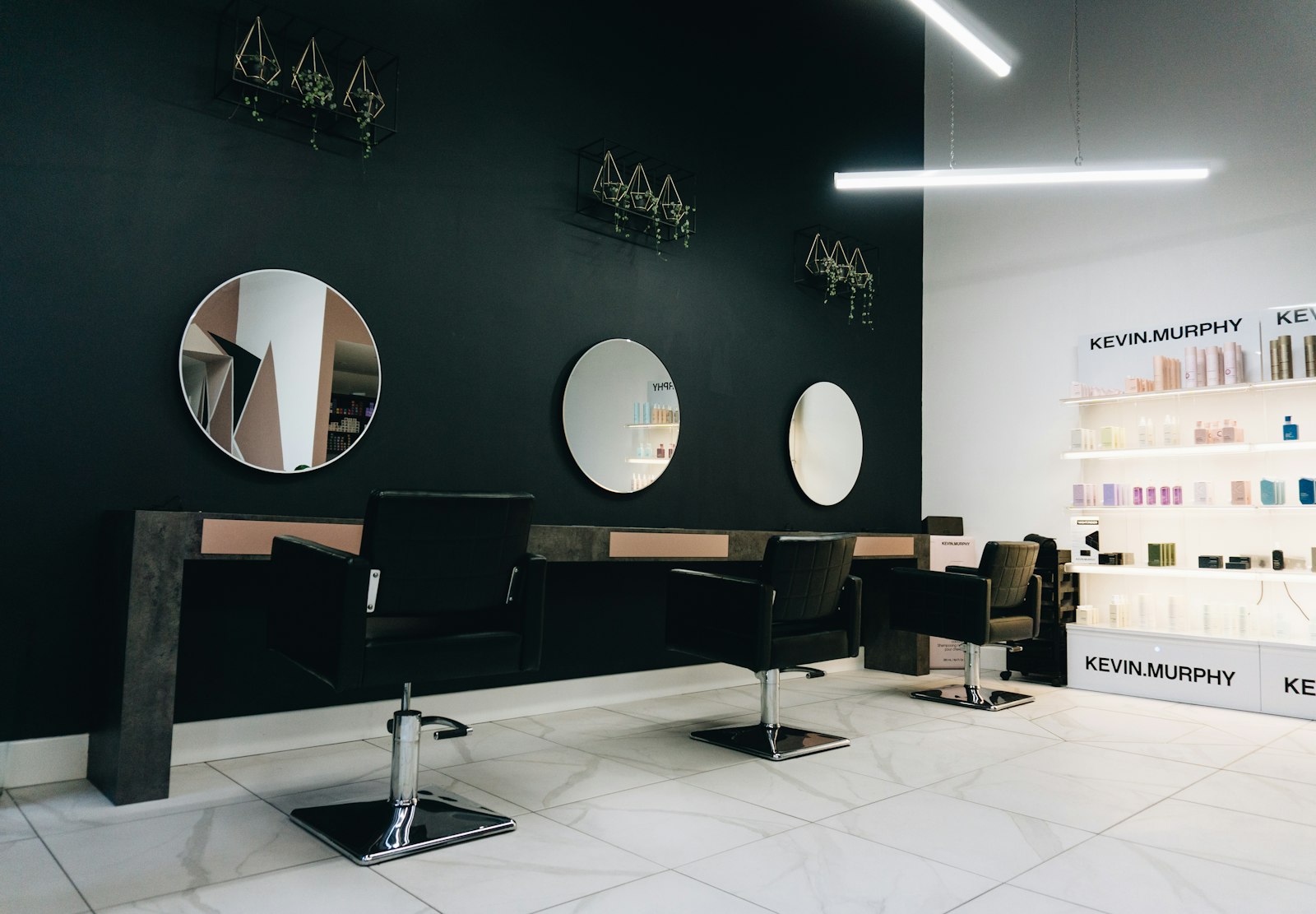 Hair salon interior with round mirrors