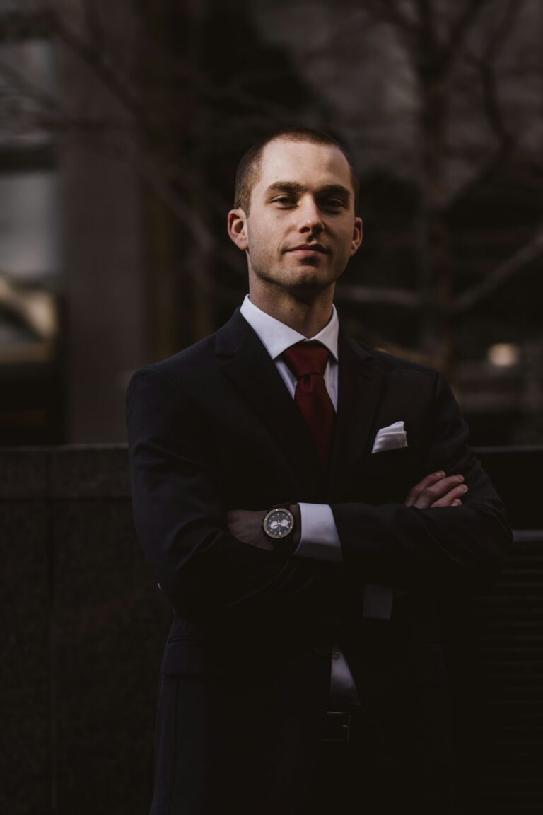 Man in dark suit with arms crossed